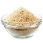 Bread crumbs in a glass bowl isolated on a white background
